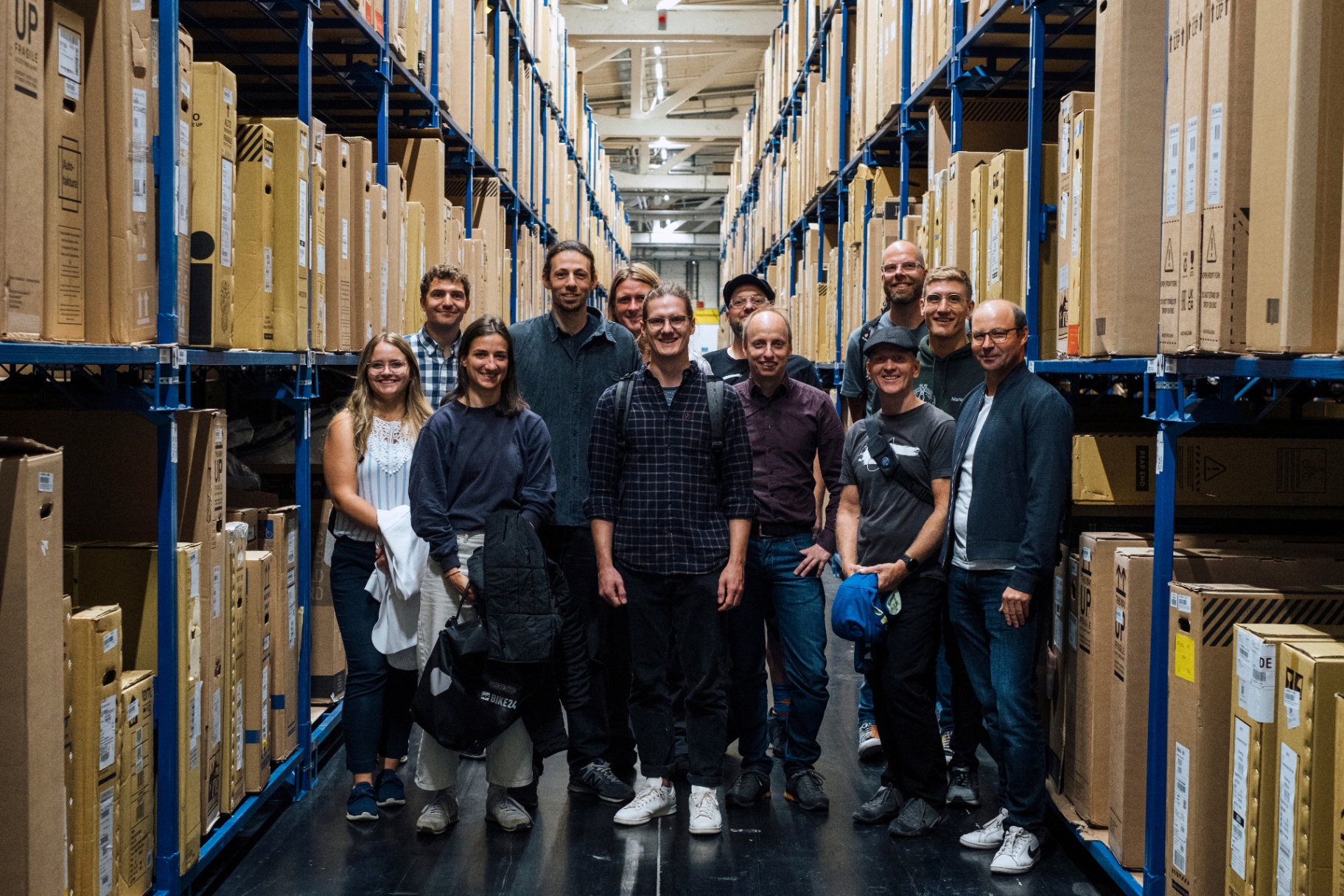 Tour group visiting the Bike24 warehouse in Saxony