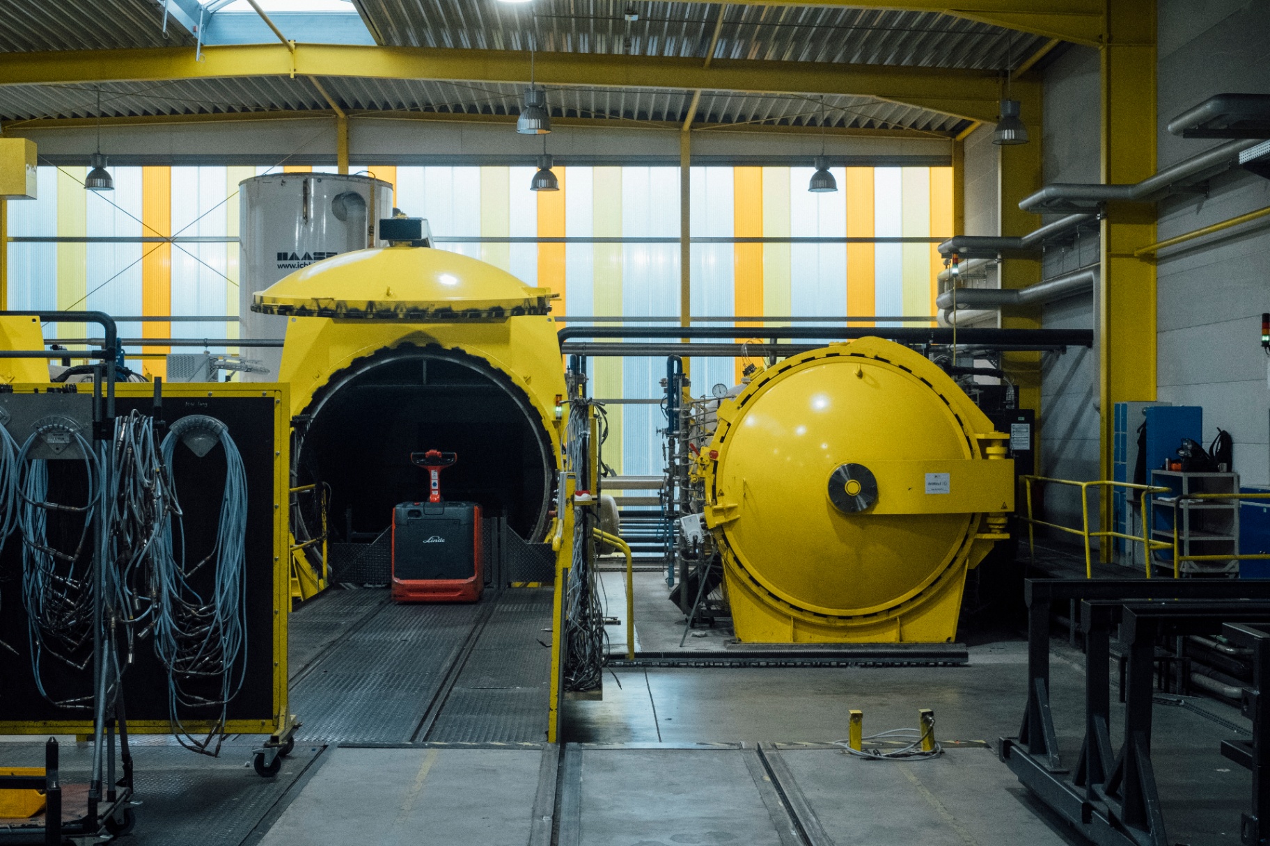 Large yellow autoclaves in a Saxony bicycle manufacturing facility